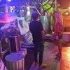 Daniel Cheong explaining his photo to a woman at Photo exhibition