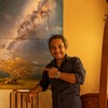 Kurt Francois posing proudly next to his Miky Way photo