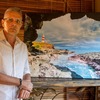 Arthur Movsisyan and his lighthouse photo during photo exhibition in Albion