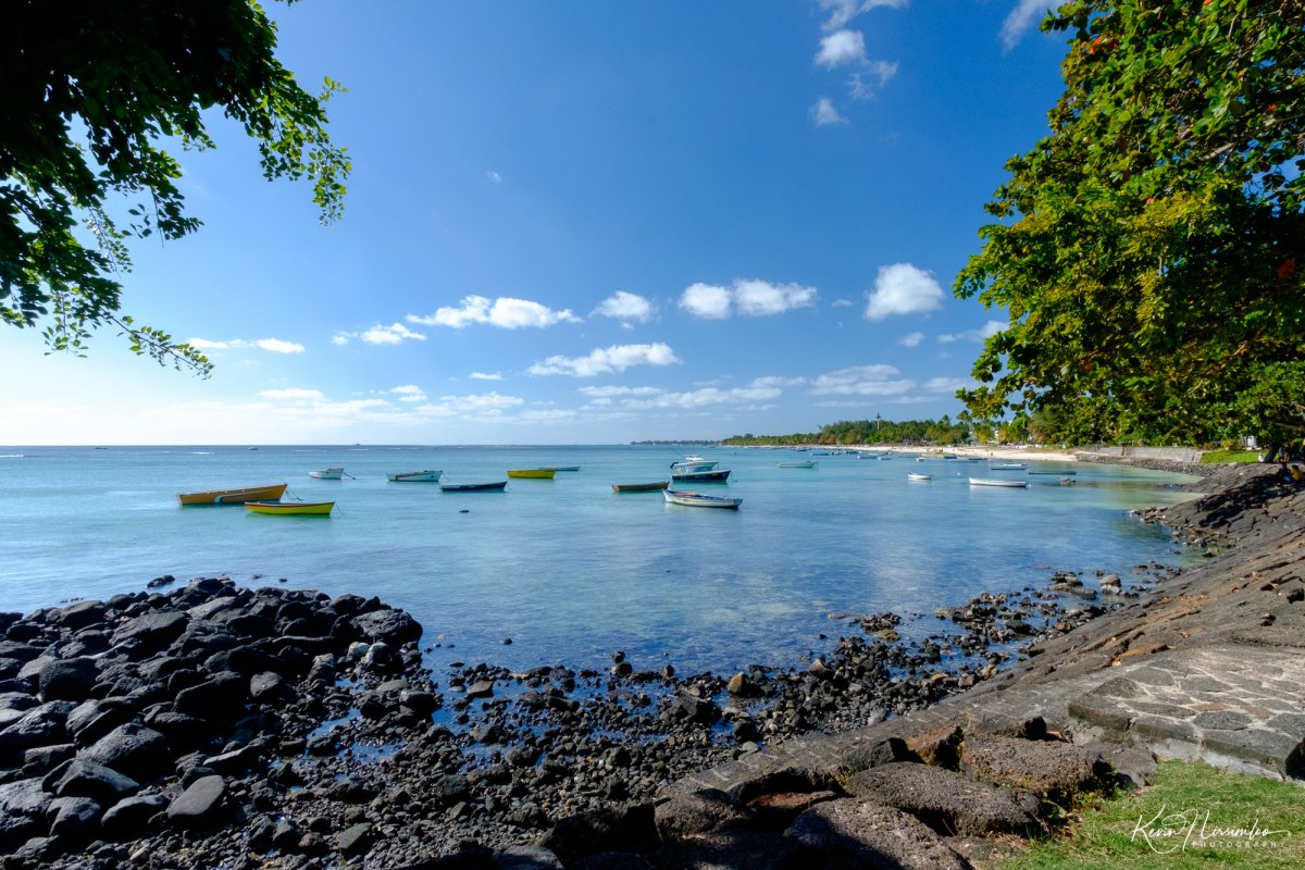 100+ Free Photos - Fishing boats in calm lagoon of Trou aux Biches